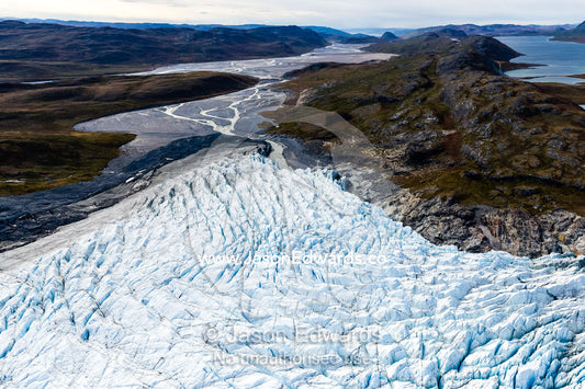 Pressure ridges and crevasse scar the surface of a glacier on the Greenland Ice Sheet. Qinnguata Kuussua River, Russell Glacier, Greenland Ice Sheet, Qeqqata Municipality, Kangerlussuaq, Greenland.