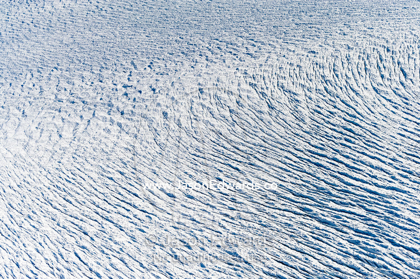 Pressure ridges and crevasse scar the surface of a glacier on the Greenland Ice Sheet Greenland Ice Sheet, Qeqqata Municipality, Kangerlussuaq, Greenland.