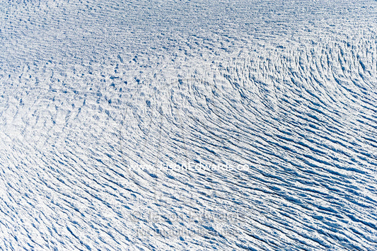 Pressure ridges and crevasse scar the surface of a glacier on the Greenland Ice Sheet Greenland Ice Sheet, Qeqqata Municipality, Kangerlussuaq, Greenland.
