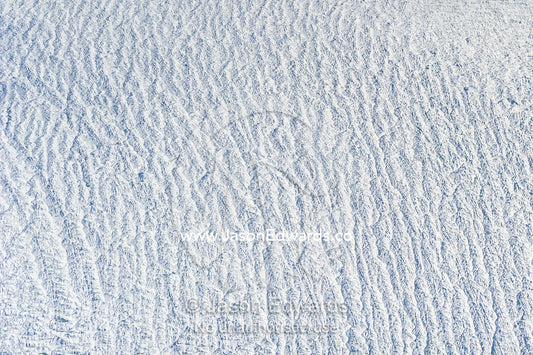 Pressure ridges and crevasse scar the surface of a glacier on the Greenland Ice Sheet. Greenland Ice Sheet, Qeqqata Municipality, Kangerlussuaq, Greenland.