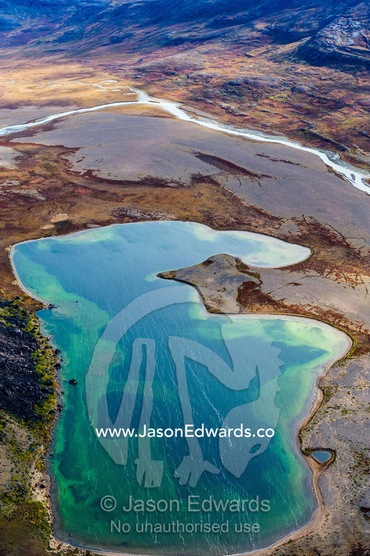 The windswept surface of a deep alpine lake on a highland tundra. Tarajornitsut Highlands, Qeqqata Municipality, Kangerlussuaq, Greenland.