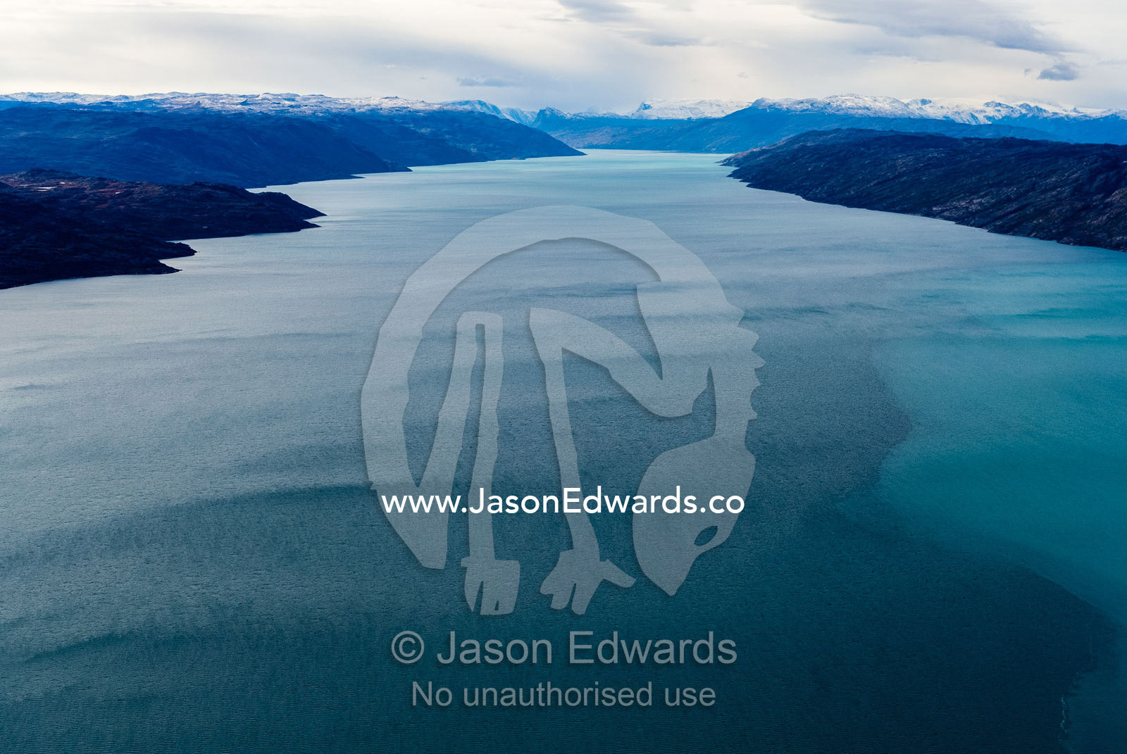 The dark waters of the Kangerlussuaq Fjord flowing toward the sea. Davis Strait, Kangerlussuaq Fjord, Kangerlussuaq, Qeqqata Municipality, Greenland.