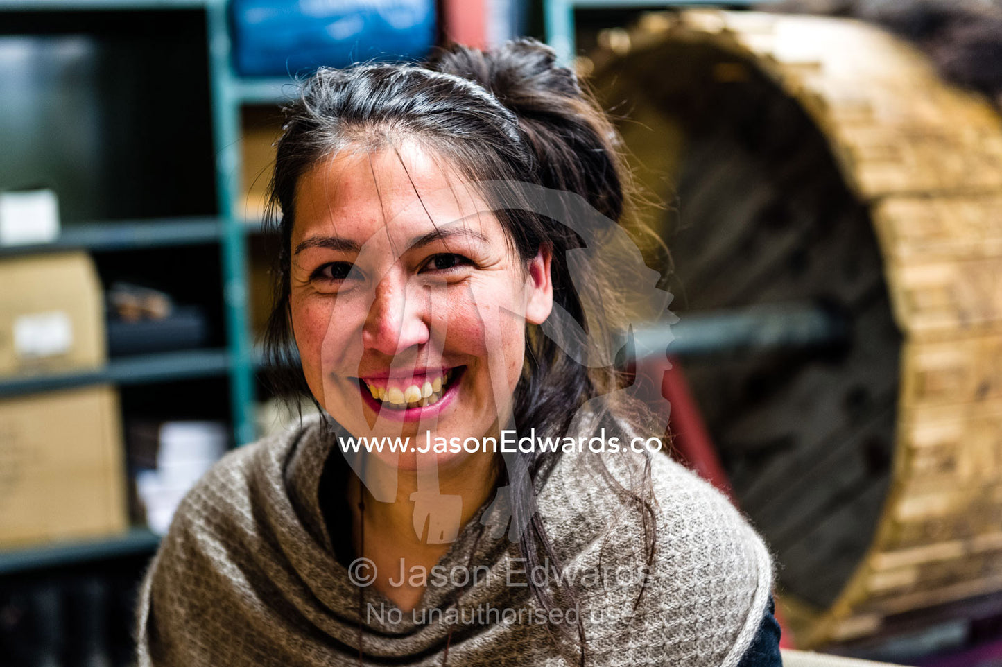 A Musk Ox jewelry artist smiling in her studio. Kangerlussuaq, Qeqqata Municipality, Greenland.