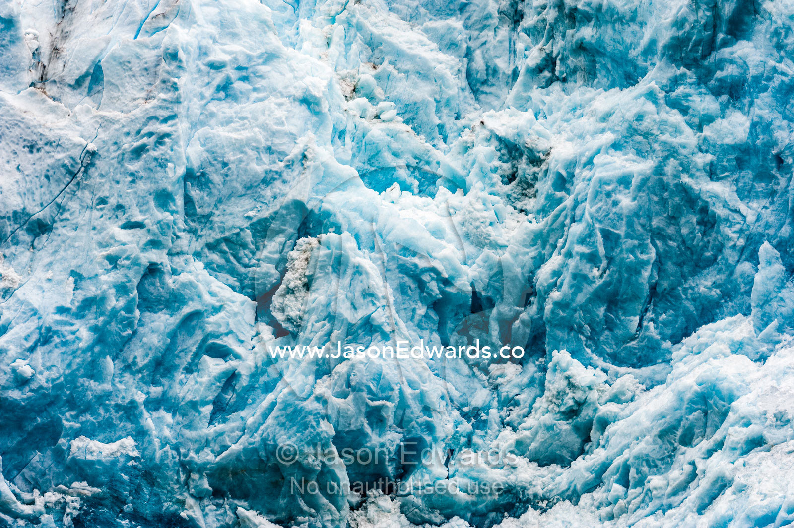 Shattered blue ice on the cliff of a glacier fracture zone. Fjord of Eternity, Maniitsoq, Sukkertoppen, Qeqqata Municipality, Greenland.
