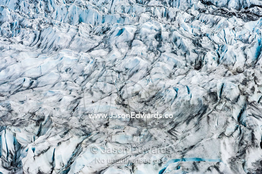 Pressure ridges and crevasse scar the surface of a glacier. Fjord of Eternity, Maniitsoq, Sukkertoppen, Qeqqata Municipality, Greenland.
