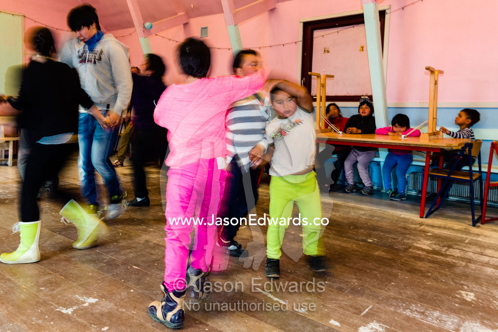 Children practicing traditional dances in a village hall. Kangaamiut, Gammel Sukkertoppen, Qeqqata Municipality, Greenland.