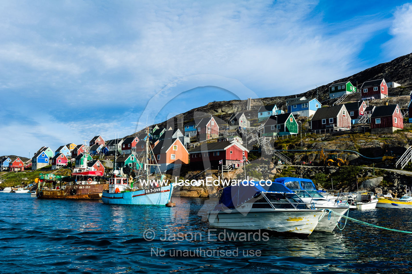 Fishing boast in the quiet harbor of a village on an arctic island. Kangaamiut, Gammel Sukkertoppen, Qeqqata Municipality, Greenland.