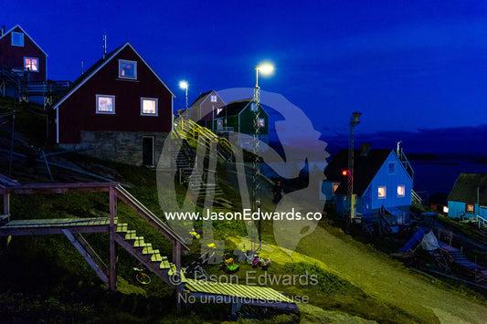 Stairs leading to cottages in an arctic village at night. Kangaamiut, Gammel Sukkertoppen, Qeqqata Municipality, Greenland.