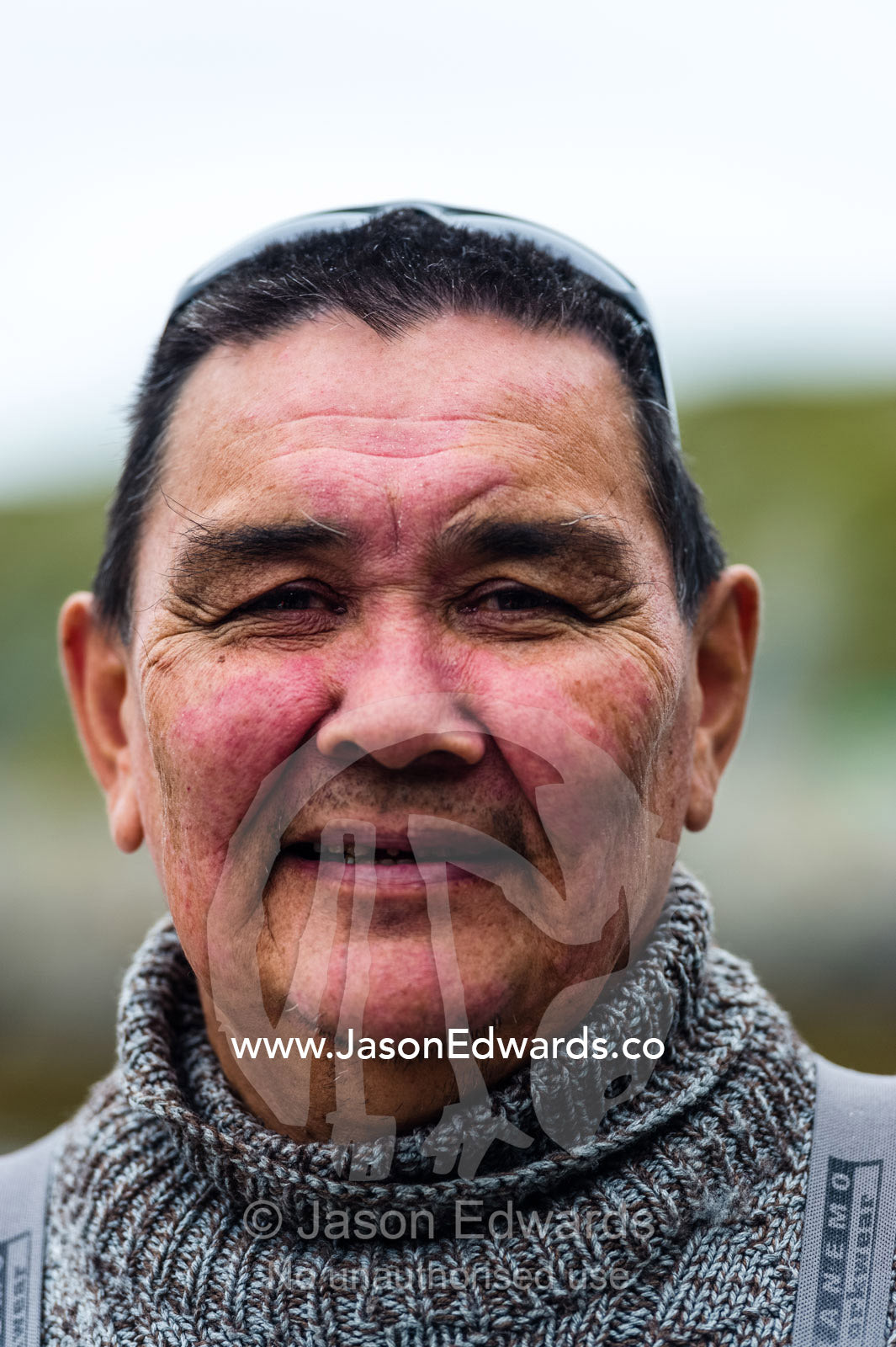 The smiling weathered face of an arctic fisherman. Kangaamiut, Gammel Sukkertoppen, Qeqqata Municipality, Greenland.