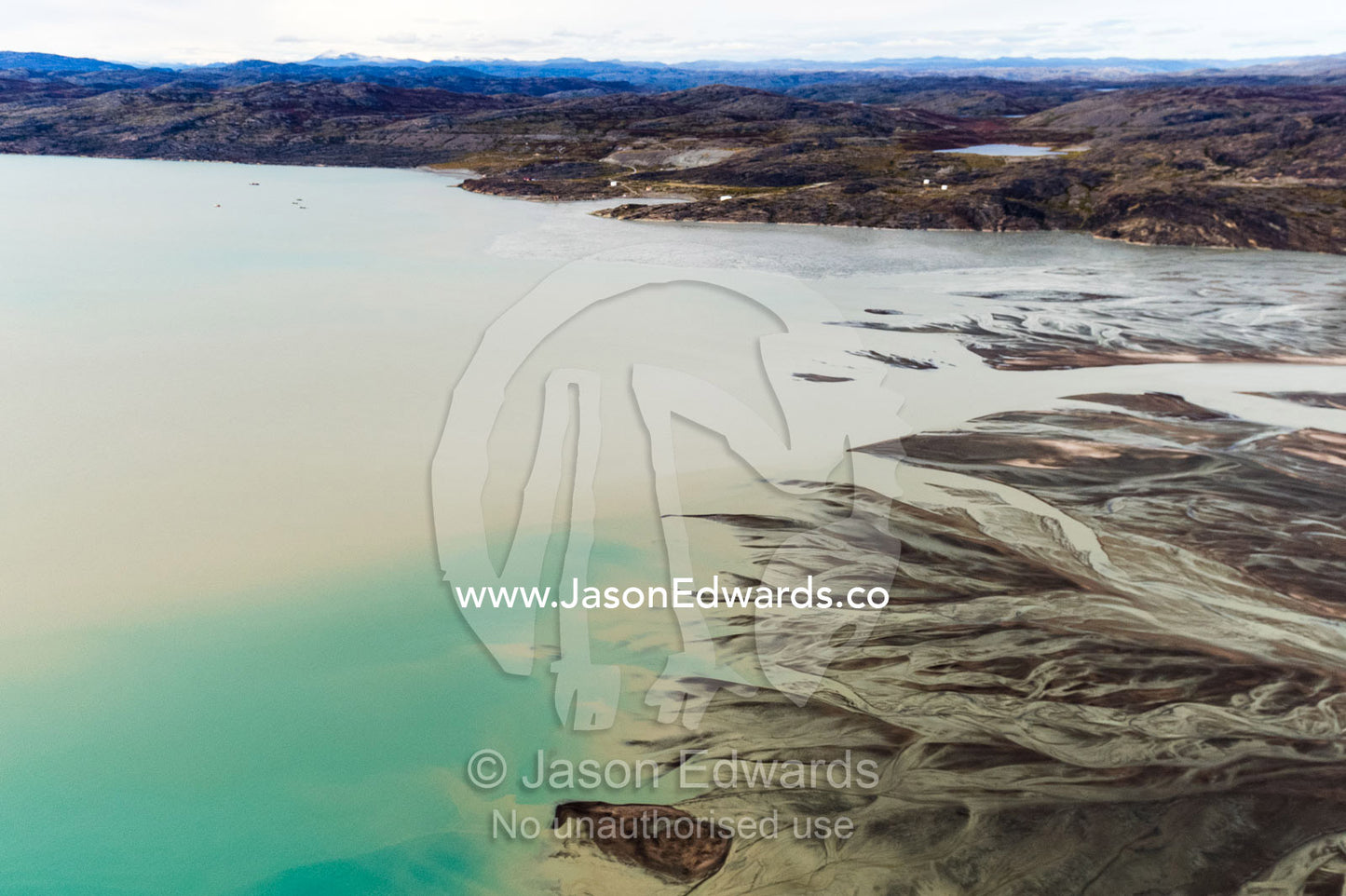 An outwash plain created by a river flowing with meltwater and sediment from a glacier. Davis Strait, Kangerlussuaq Fjord, Kangerlussuaq, Qeqqata Municipality, Greenland.