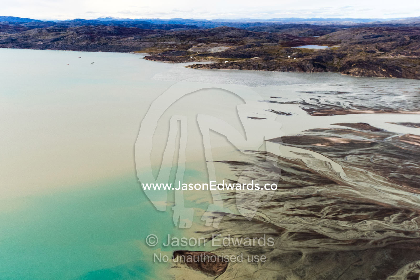 An outwash plain created by a river flowing with meltwater and sediment from a glacier. Davis Strait, Kangerlussuaq Fjord, Kangerlussuaq, Qeqqata Municipality, Greenland.