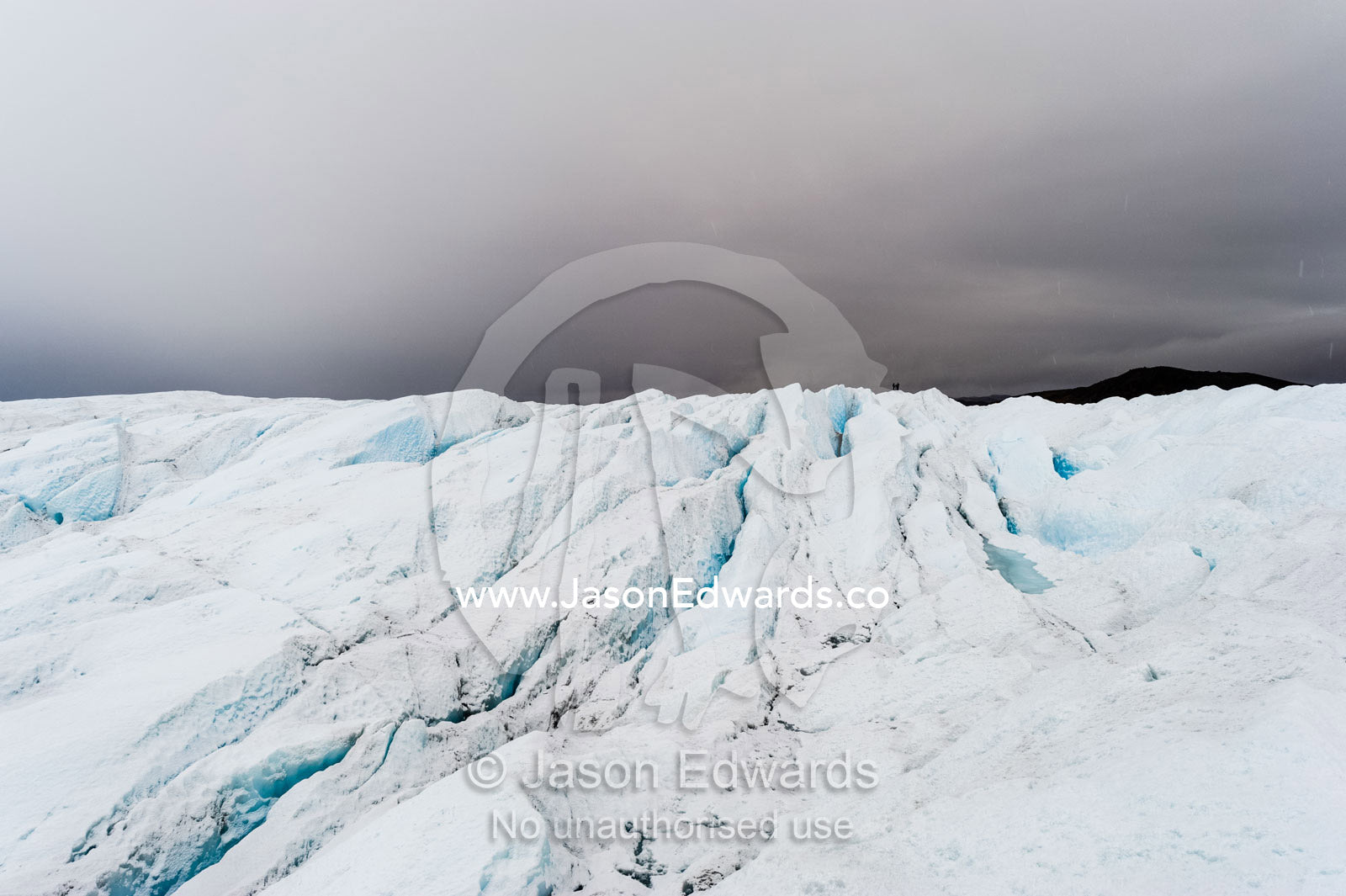 The frozen and barren wasteland of folded ice and crevasse on the surface of the Greenland Ice Sheet. Greenland Ice Sheet, Qeqqata Municipality, Kangerlussuaq, Greenland.