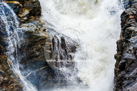 Meltwater floods a cascading waterfall at the base of a glacier. Qinnguata Kuussua River, Russell Glacier, Greenland Ice Sheet, Qeqqata Municipality, Kangerlussuaq, Greenland.
