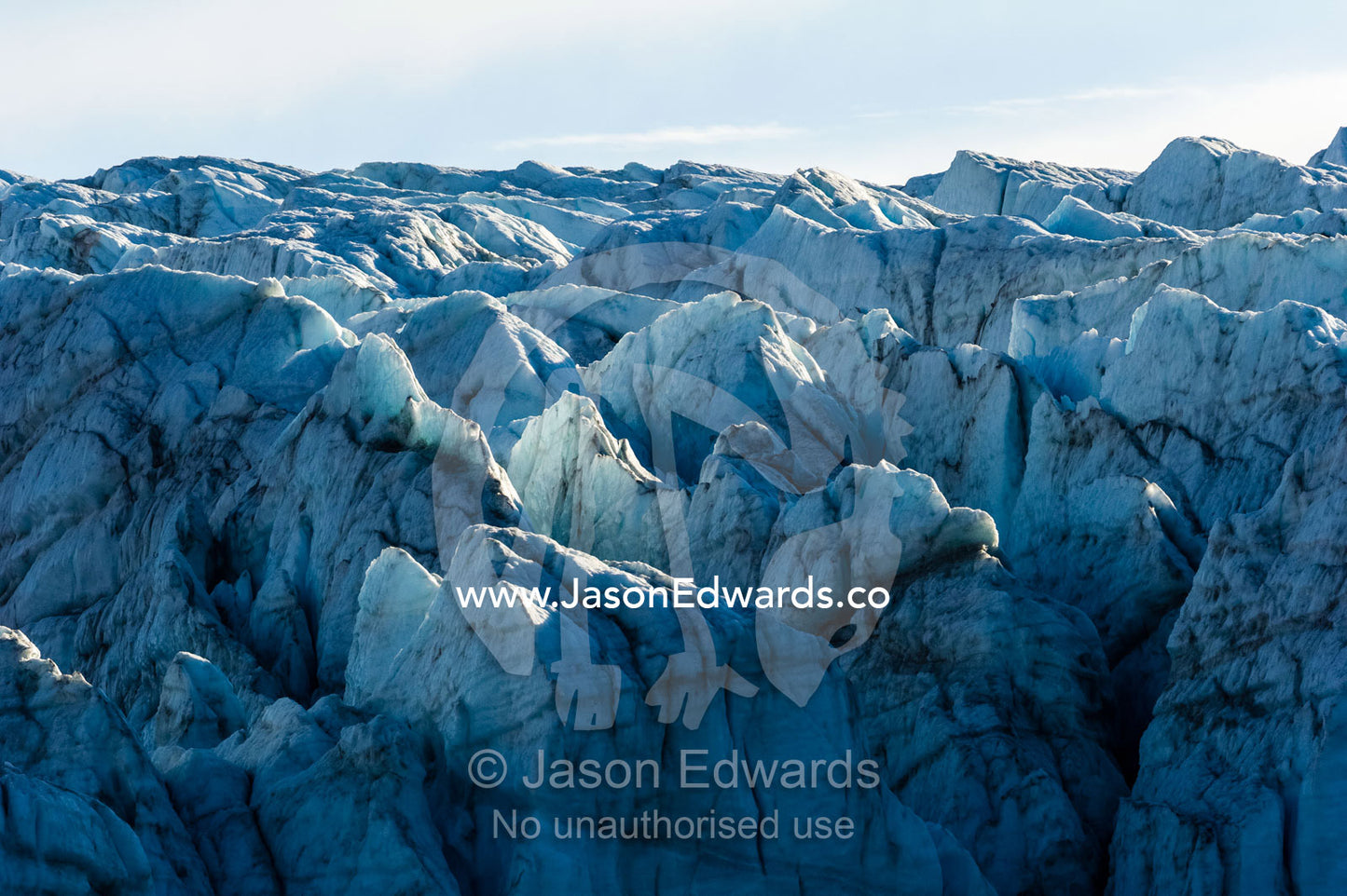 Treacherous jagged ice spires on a glacier fracture zone known as serac. Russell Glacier, Greenland Ice Sheet, Qeqqata Municipality, Kangerlussuaq, Greenland.