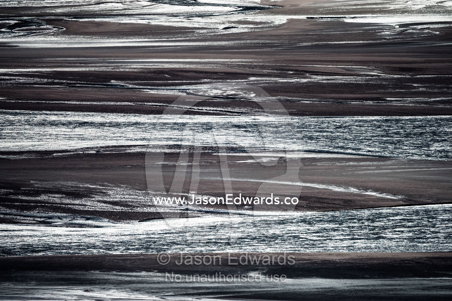 Sunrays illuminate a vast river floodplain carrying glacier run-off that creates quicksand plains. Qinnguata Kuussua River, Russell Glacier, Greenland Ice Sheet, Qeqqata Municipality, Kangerlussuaq, Greenland.