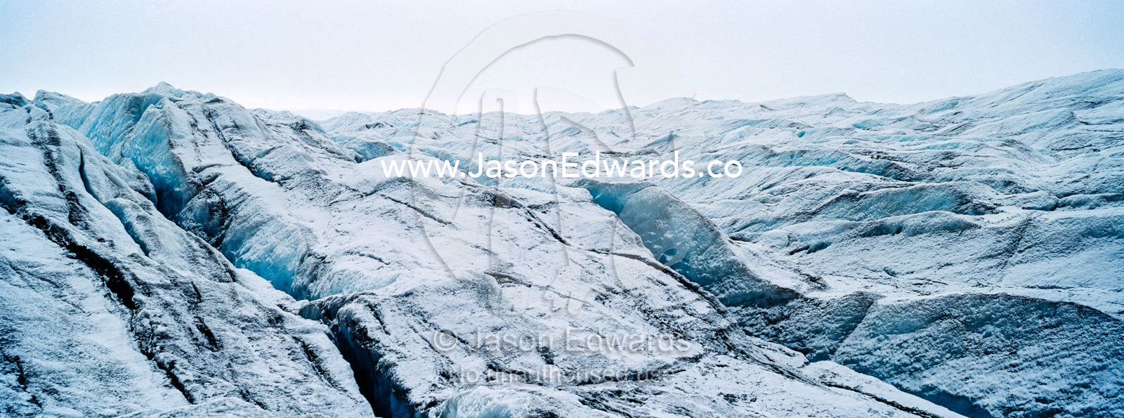 The frozen and barren wasteland of folded ice and crevasse on the surface of the Greenland Ice Sheet. Greenland Ice Sheet, Qeqqata Municipality, Kangerlussuaq, Greenland.