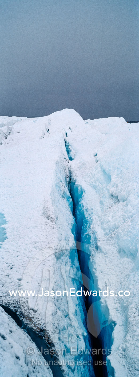 The frozen and barren wasteland of folded ice and crevasse on the surface of the Greenland Ice Sheet. Greenland Ice Sheet, Qeqqata Municipality, Kangerlussuaq, Greenland.
