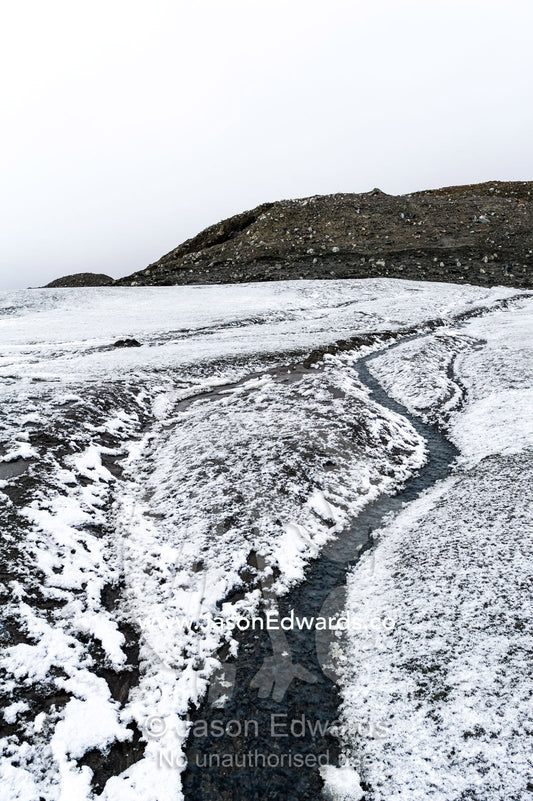 A meltwater stream flowing down from the Greenland Ice Sheet. Isunngua Highland, Greenland Ice Sheet, Kangerlussuaq, Qeqqata Municipality, Greenland.
