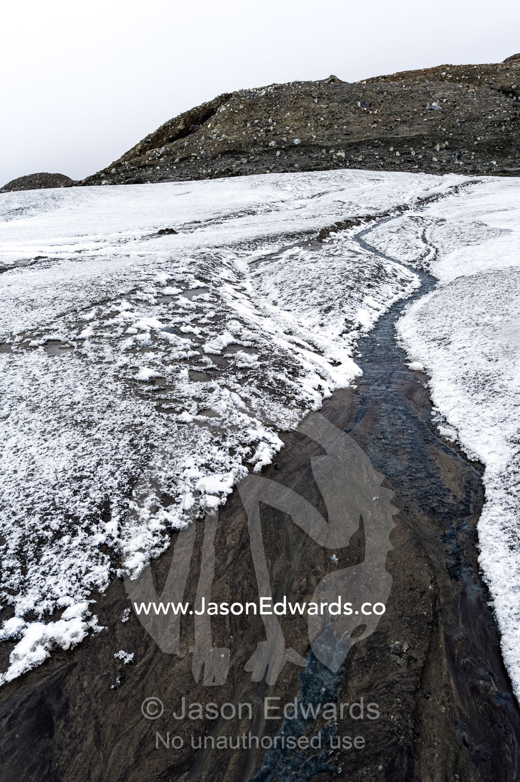 A meltwater stream flowing down from the Greenland Ice Sheet. Isunngua Highland, Greenland Ice Sheet, Kangerlussuaq, Qeqqata Municipality, Greenland.