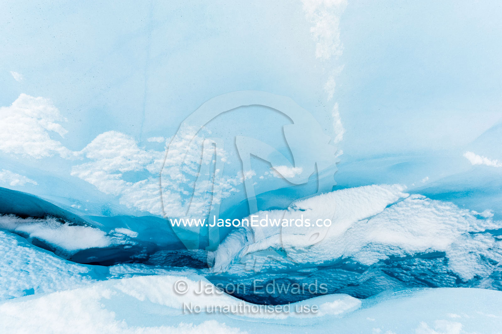 Looking into the depths of a crevasse on the frozen surface of the Greenland Ice Sheet. Greenland Ice Sheet, Qeqqata Municipality, Kangerlussuaq, Greenland.