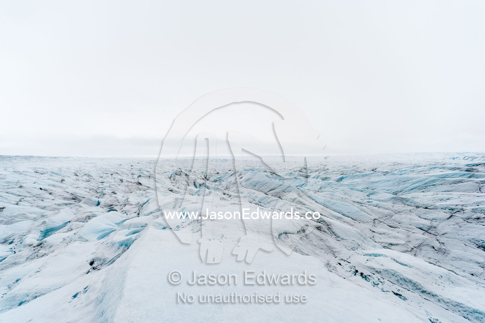 The frozen and barren wasteland of folded ice on the surface of the Greenland Ice Sheet. Greenland Ice Sheet, Qeqqata Municipality, Kangerlussuaq, Greenland.