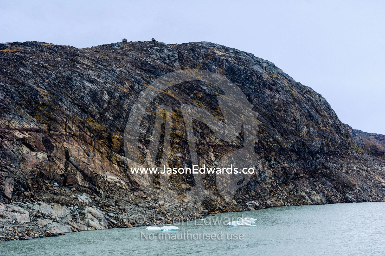 Gauge marks in a cliff face and shoreline where a receding glacier has scoured the rock. Isunngua Highland, Greenland Ice Sheet, Kangerlussuaq, Qeqqata Municipality, Greenland.