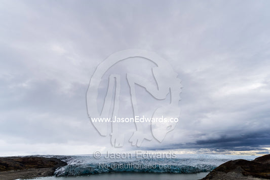The ice fracture zone of a glacier on the Greenland Ice Sheet ending in a lake. Isunngua Highland, Greenland Ice Sheet, Kangerlussuaq, Qeqqata Municipality, Greenland.