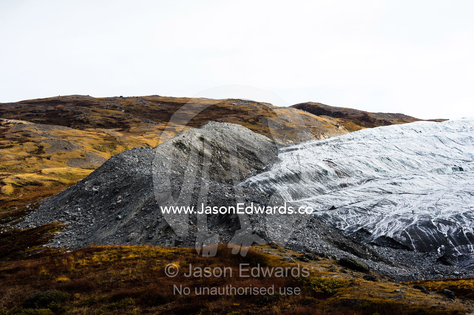 A pile of rock and silt debris deposited by the leading edge of a glacier. Russell Glacier, Greenland Ice Sheet, Qeqqata Municipality, Kangerlussuaq, Greenland.