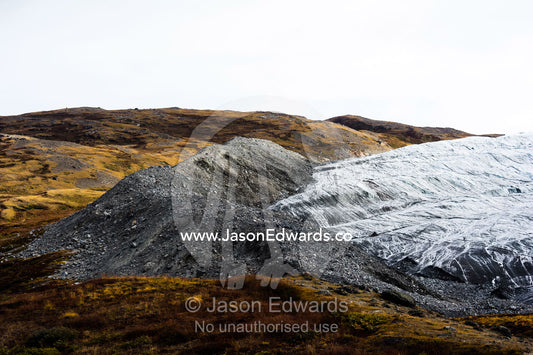 A pile of rock and silt debris deposited by the leading edge of a glacier. Russell Glacier, Greenland Ice Sheet, Qeqqata Municipality, Kangerlussuaq, Greenland.