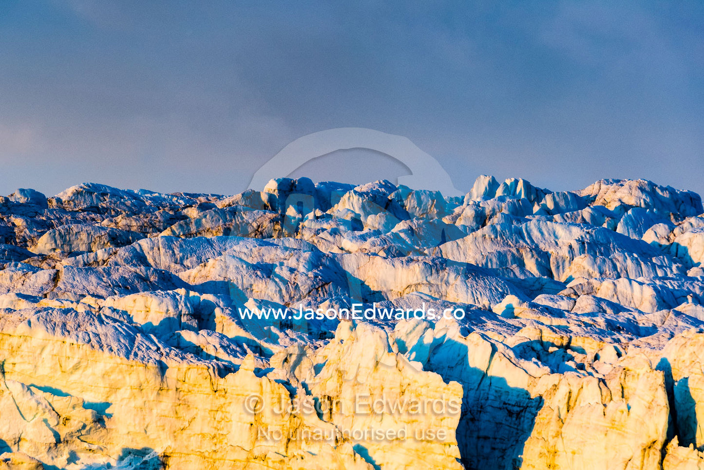 Pastel hues across a field of crevasse and pressure ridges in the fracture zone of a glacier. Russell Glacier, Greenland Ice Sheet, Qeqqata Municipality, Kangerlussuaq, Greenland.