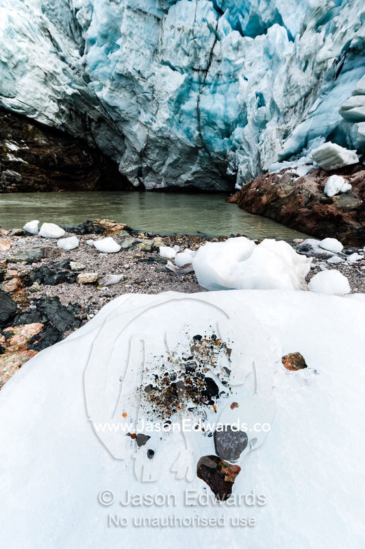 Pebbles trapped in a glacier exposed after the ice melts. Russell Glacier, Greenland Ice Sheet, Qeqqata Municipality, Kangerlussuaq, Greenland.