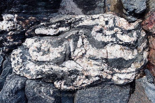 Layers of quartz imbedded in a rock exposed by a receding glacier. Russell Glacier, Greenland Ice Sheet, Qeqqata Municipality, Kangerlussuaq, Greenland.