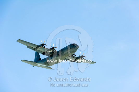 An airforce Hercules aircraft flying over the Greenland Ice Sheet. Russell Glacier, Greenland Ice Sheet, Qeqqata Municipality, Kangerlussuaq, Greenland.