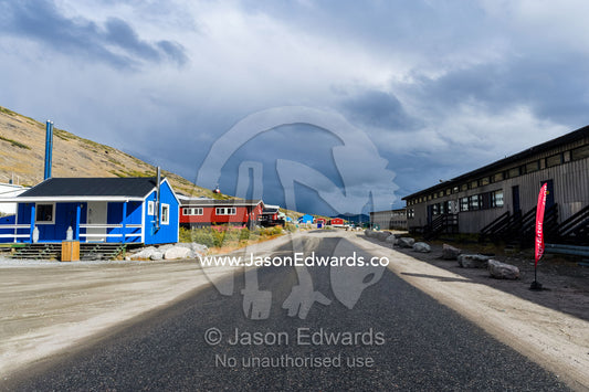 The quiet main street of an arctic village. Kangerlussuaq, Qeqqata Municipality, Greenland.