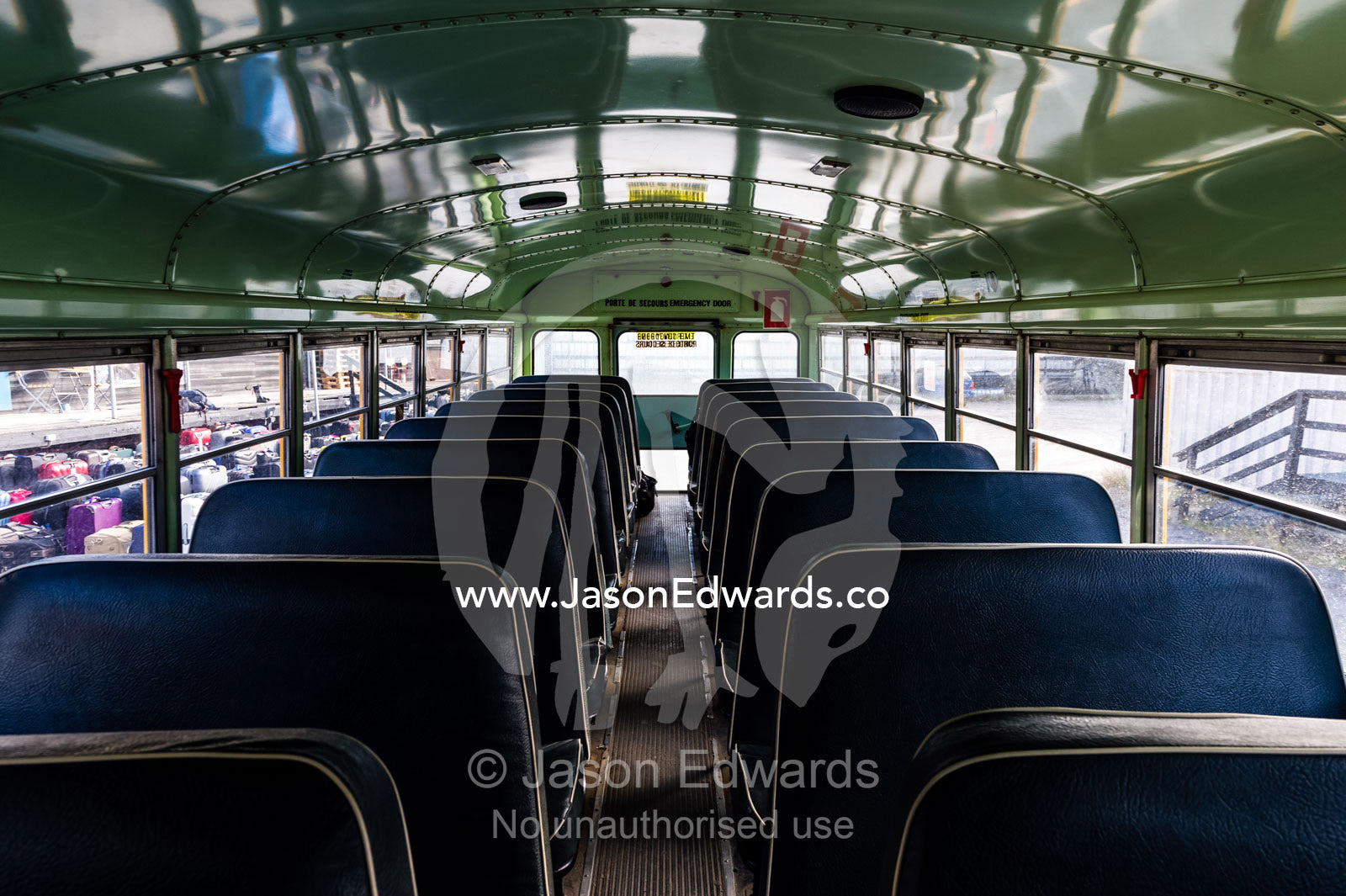 Empty seats on a bus waiting to collect airport passengers. Kangerlussuaq, Qeqqata Municipality, Greenland.