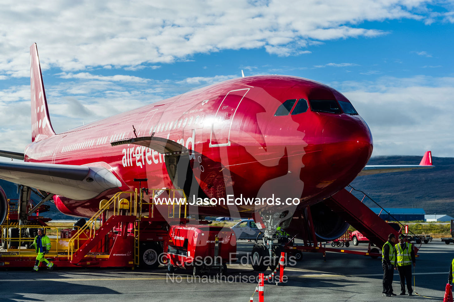 A passenger aircraft unloading cargo at an Arctic airport. Kangerlussuaq Airport, Kangerlussuaq, Qeqqata Municipality, Greenland.