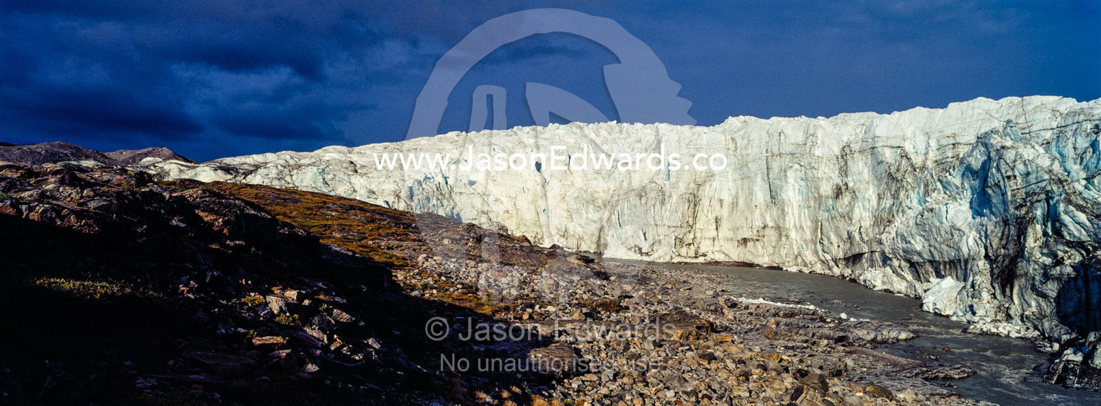 A river flowing along the fracture zone of an enormous glacier. Qinnguata Kuussua River, Russell Glacier, Greenland Ice Sheet, Qeqqata Municipality, Kangerlussuaq, Greenland.
