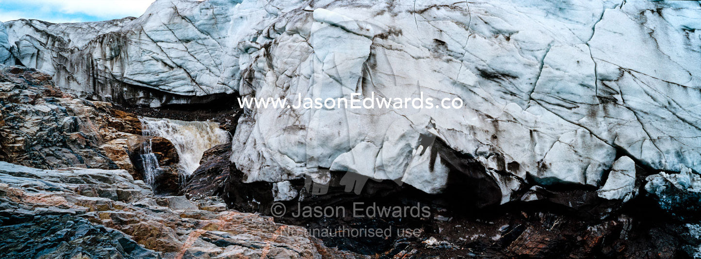 A river flowing along the fracture zone of an enormous glacier. Qinnguata Kuussua River, Russell Glacier, Greenland Ice Sheet, Qeqqata Municipality, Kangerlussuaq, Greenland.