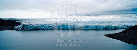 The fracture zone of a glacier on the Greenland Ice Sheet ending in a lake. Isunngua Highland, Greenland Ice Sheet, Kangerlussuaq, Qeqqata Municipality, Greenland.