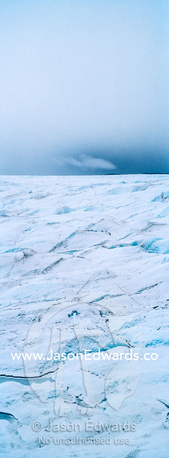 The frozen and barren wasteland of folded ice on the surface of the Greenland Ice Sheet. Greenland Ice Sheet, Qeqqata Municipality, Kangerlussuaq, Greenland.