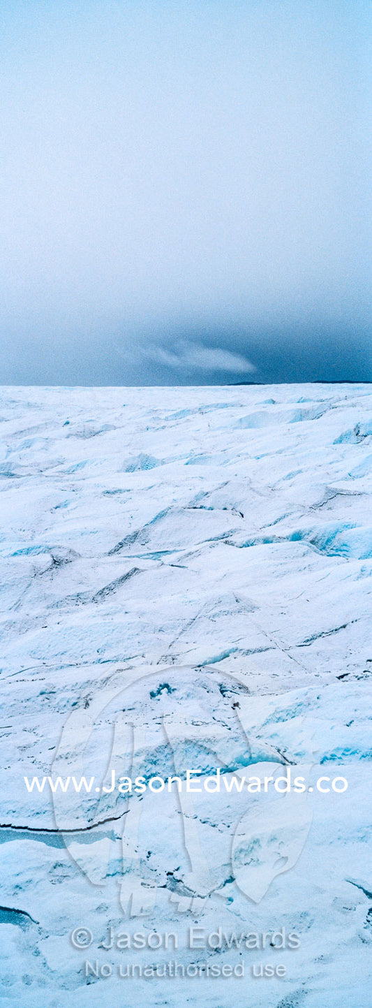 The frozen and barren wasteland of folded ice on the surface of the Greenland Ice Sheet. Greenland Ice Sheet, Qeqqata Municipality, Kangerlussuaq, Greenland.