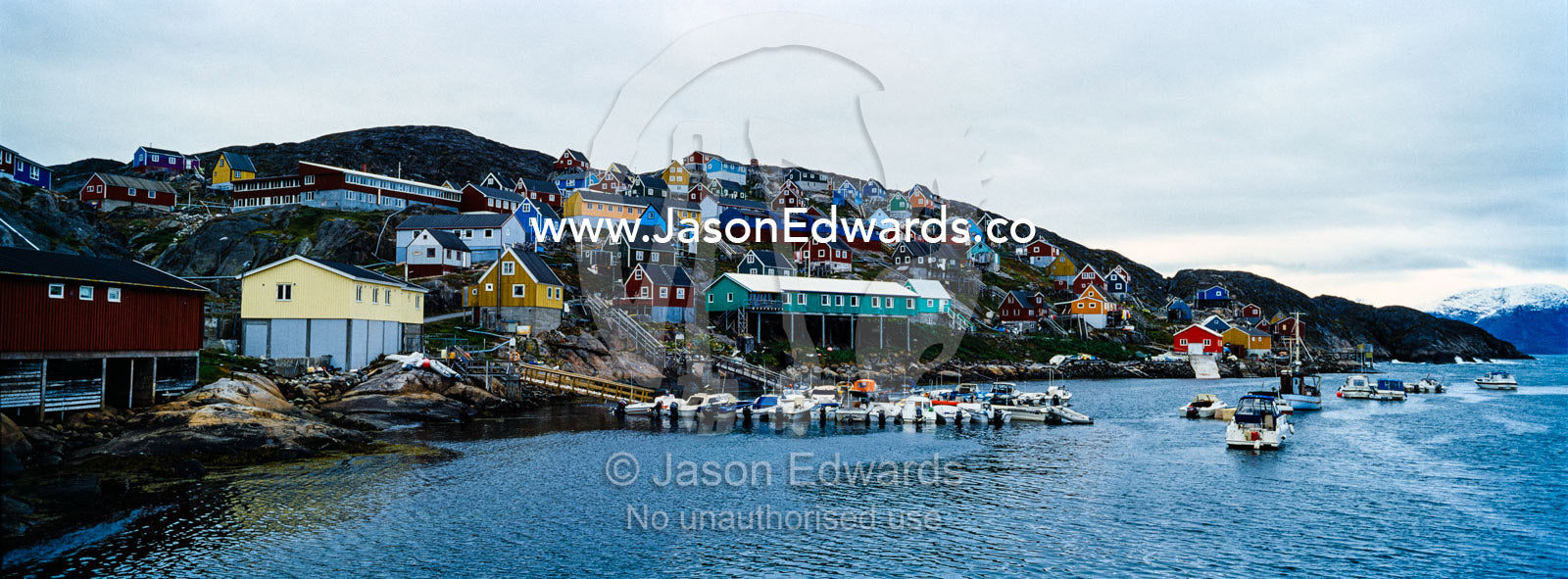 A fishing village and harbor perched on a barren arctic island. Kangaamiut, Gammel Sukkertoppen, Qeqqata Municipality, Greenland.