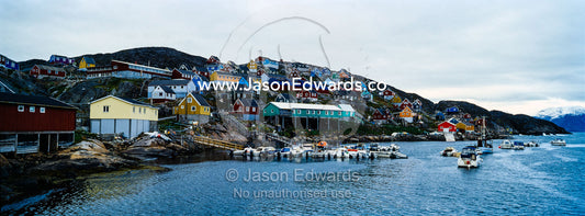 A fishing village and harbor perched on a barren arctic island. Kangaamiut, Gammel Sukkertoppen, Qeqqata Municipality, Greenland.
