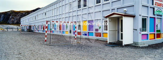 Soccer goal posts in the playground of an elementary school in an arctic village. Kangerlussuaq, Qeqqata Municipality, Greenland.
