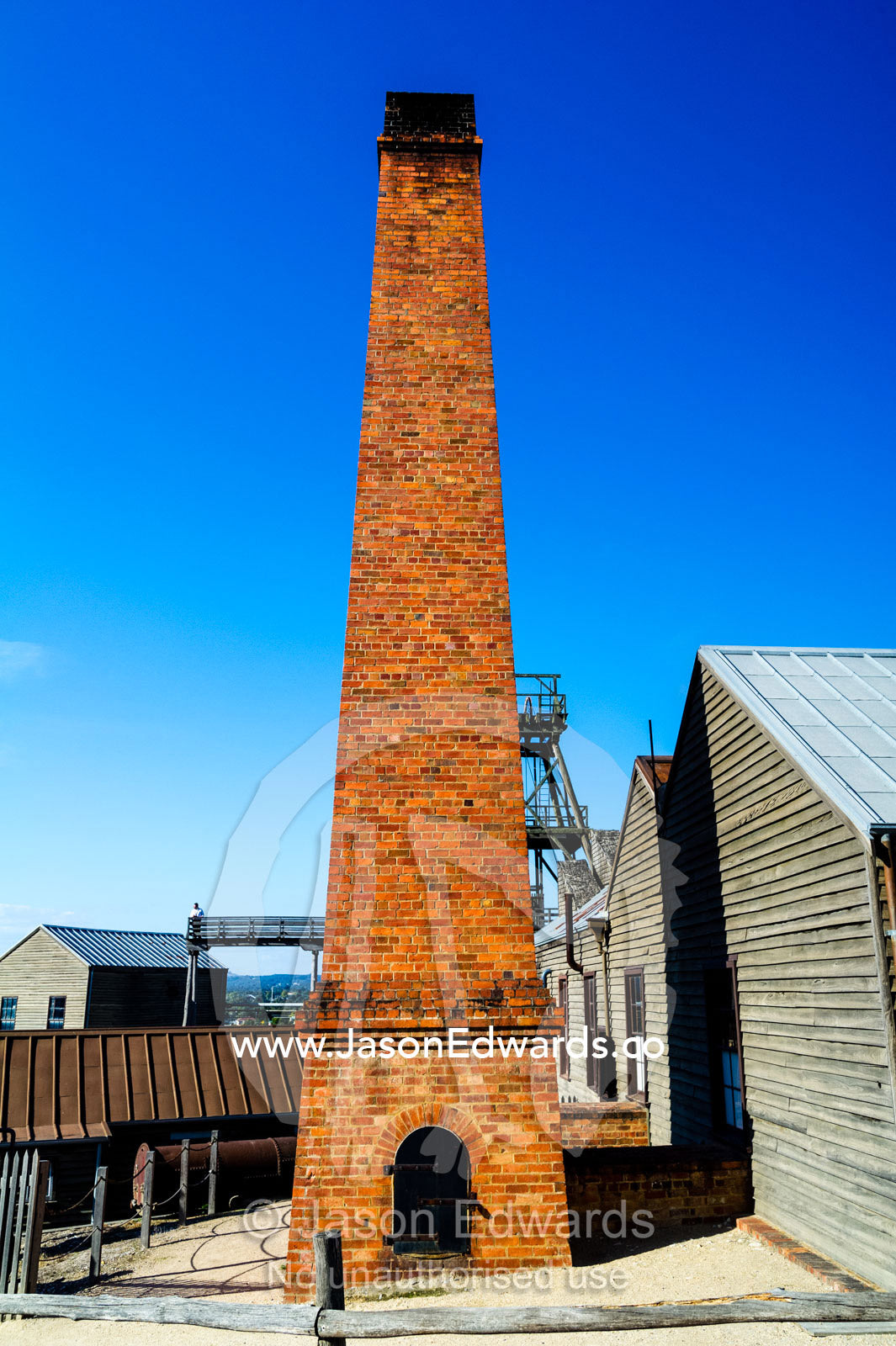 A chimney stack is part of the steam operations for the boiler and engine house in a gold town museum. Sovereign Hill, Ballarat, Victoria, Australia.