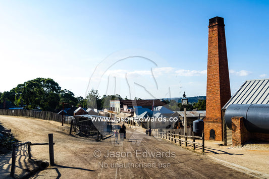 A chimney stack is part of the steam operations for the boiler and engine house in a gold town museum. Sovereign Hill, Ballarat, Victoria, Australia.