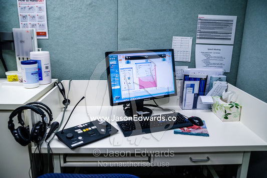Computers and hearing test equipment in an audiologist clinic. The University of Melbourne Audiology Clinic, Carlton, Melbourne, Victoria, Australia.