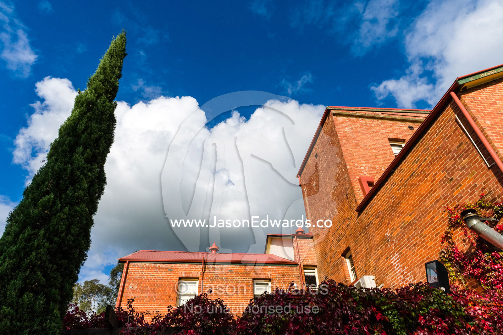 The Victorian red brick facade of an antique butter and ice factory. Euroa Butter and Ice Factory, Euroa, Strathbogie, Victoria, Australia.