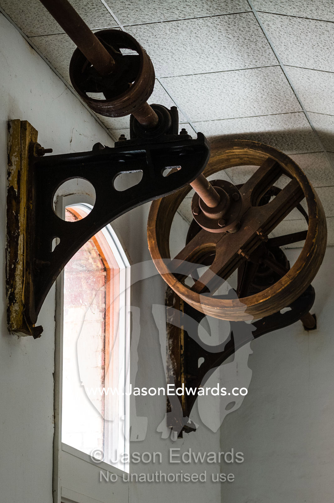 An antique steel winch wheel in a butter and ice factory. Euroa Butter and Ice Factory, Euroa, Strathbogie, Victoria, Australia.
