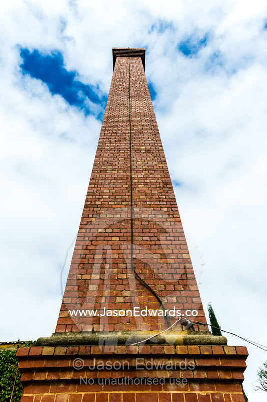 The Victorian red brick chimney in an antique butter and ice factory. Euroa Butter and Ice Factory, Euroa, Strathbogie, Victoria, Australia.